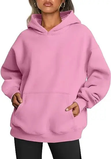 Women’s Hoodies With Pockets Big in pink, featuring an oversized fit and practical pockets for comfort and style.